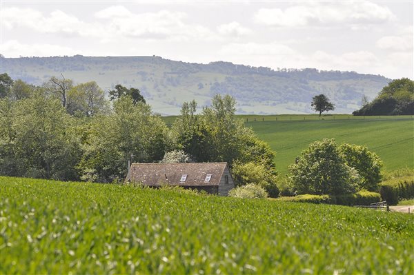 A view of the Old Saw Barn from the fields